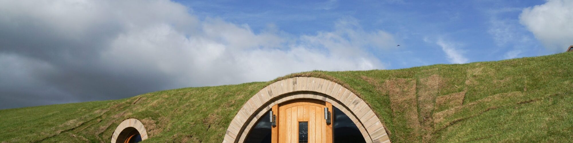 An underground house covered in grass